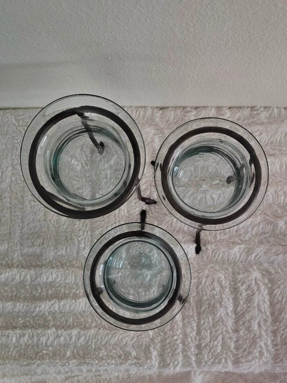 Wrought iron and hand-blown glass candle holders